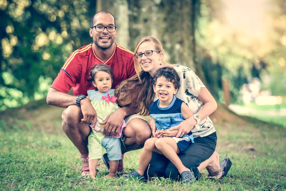 Family of four smiling